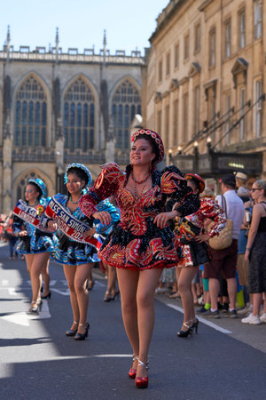 Bath, England, United Kingdom - 9 July 2022: Caporales dancers in ornate costumes performing at the annual carnival as it progresses through the streets of the historic city of Batのeditorial素材