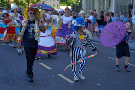 Bath, England, United Kingdom - 9 July 2022: Carnival parade progressing through the streets of the...