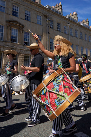 Bath, England, United Kingdom - 9 July 2022: Drumming band performing at the annual carnival as it progresses through the streets of the historic city of Bath in Somerset.のeditorial素材