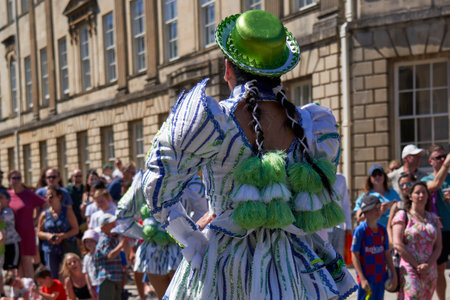 Bath, England, United Kingdom - 9 July 2022: Caporales dancers in ornate costumes performing at the annual carnival as it progresses through the streets of the historic city of Batのeditorial素材