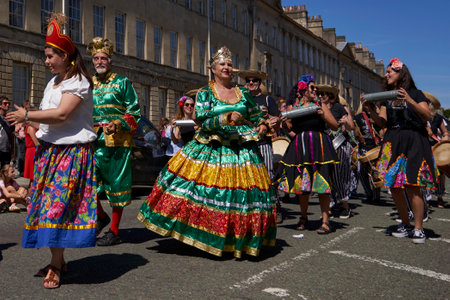 Bath, England, United Kingdom - 9 July 2022: Carnival parade progressing through the streets of the historic city of Bath in Somerset.のeditorial素材