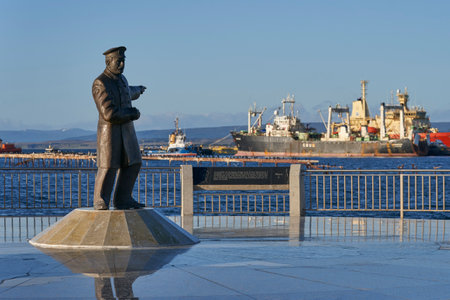 Statue of Piloto Pardo alongside the bow of the ship the Yelcho on the waterfront of Punta Arenas commemorating the rescue of the crew of the Endurance from Elephant Island in 1916のeditorial素材