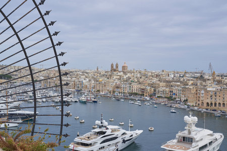 Valetta, Malta - June 6, 2023: Luxury boats moored alongside Fort Saint Angelo in Grand Harbour, Valetta, Maltaのeditorial素材