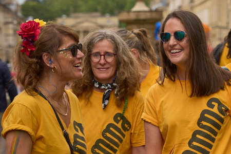 Bath, England, United Kingdom - 8 July 2023: Dancers and musicians dressed in ornate costumes parade through the streets of Bath in the annual carnival.のeditorial素材