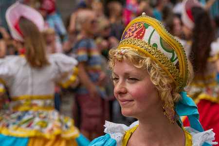 Bath, England, United Kingdom - 8 July 2023: Dancers and musicians dressed in ornate costumes parade through the streets of Bath in the annual carnival.のeditorial素材