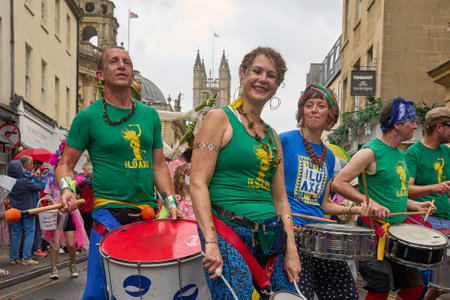 Bath, England, United Kingdom - 8 July 2023: Dancers and musicians dressed in ornate costumes parade through the streets of Bath in the annual carnival.のeditorial素材