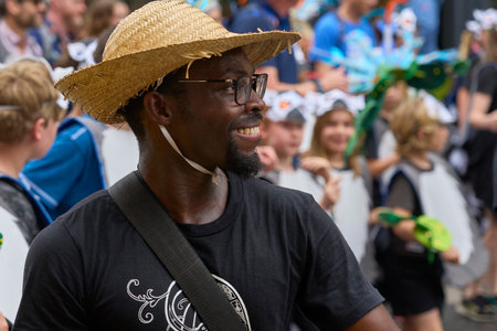 Bath, England, United Kingdom - 8 July 2023: Dancers and musicians dressed in ornate costumes parade through the streets of Bath in the annual carnival.のeditorial素材