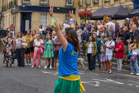Bath, England, United Kingdom - 8 July 2023: Dancers and musicians dressed in ornate costumes parade through the streets of Bath in the annual carnival.のeditorial素材