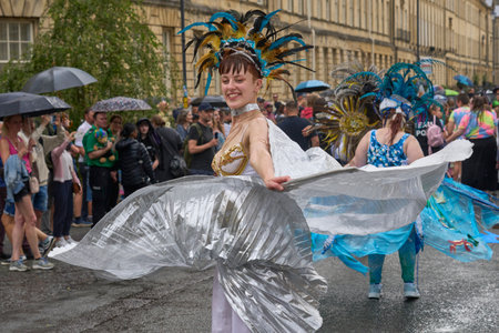 Bath, England, United Kingdom - 8 July 2023: Dancers and musicians dressed in ornate costumes parade through the streets of Bath in the annual carnival.のeditorial素材