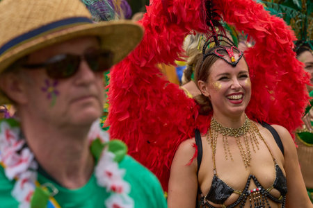 Bath, England, United Kingdom - 8 July 2023: Dancers and musicians dressed in ornate costumes parade through the streets of Bath in the annual carnival.のeditorial素材