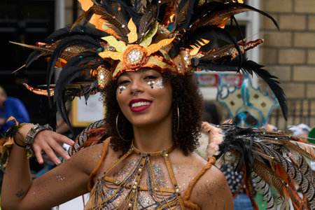 Bath, England, United Kingdom - 8 July 2023: Dancers and musicians dressed in ornate costumes parade through the streets of Bath in the annual carnival.のeditorial素材