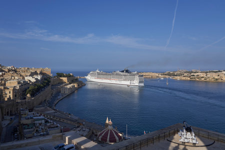 Valetta, Malta - June 11, 2023: Large cruise ship exiting the Grand Harbour at Valetta in Maltaのeditorial素材