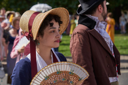 Bath, England, United Kingdom - 9 September 2023: Parade of people dressed in period costume from the Georgian era as part of the annual Jane Austen festival in Bath, Somerset, UKのeditorial素材