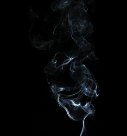 Smoke with a black background. Abstract element to help your designの写真素材