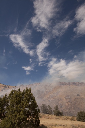 Smoking desert hillside from a fireの写真素材