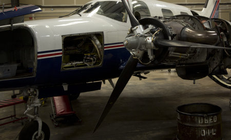 Small airplanes in the shop at an airport.