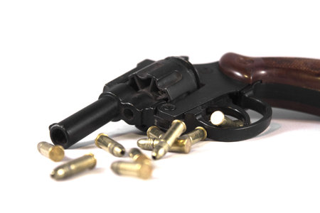 Gun and bullets isolated on a white background