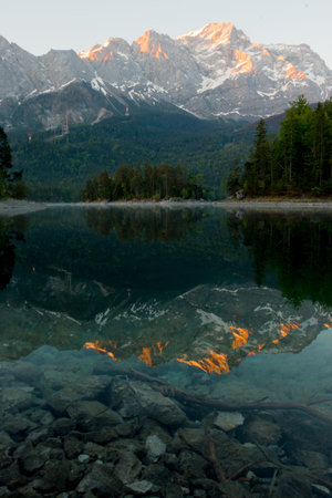 Beautiful sunrise at a famous alpine lake in Germany.