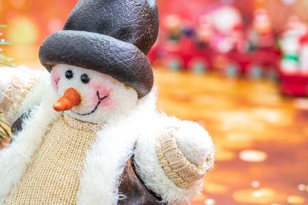 Close-up of snowman in foreground, Christmas Holiday Season background with decorations. Merry Christmas New Year collection, gifts and decorative ornaments. Empty copy space for text.の写真素材