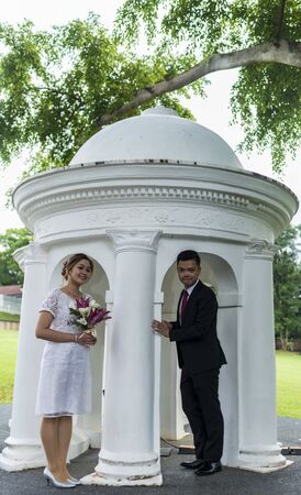 Asian loving couple pre-wedding outdoor photo shoot. Casual natural real people portraits. Loving romantic couple.の写真素材