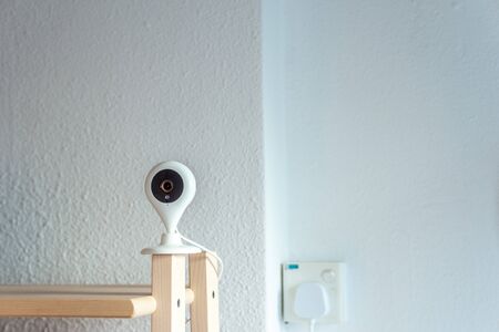 Household indoor digital CCTV Internet surveillance web cam with night vision. Technology object home digital concept.の写真素材