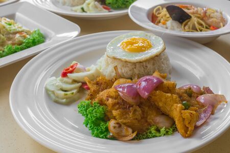 Asia Chinese food, Stir-fried sweet spicy fish with rice and sunny side eggの写真素材