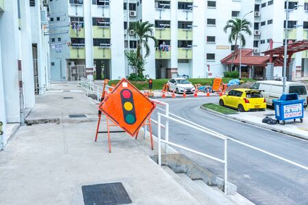 Traffic light caution signboard warning oncoming vehicles.の写真素材