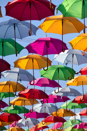 colorful umbrellas with blue sky in the background
