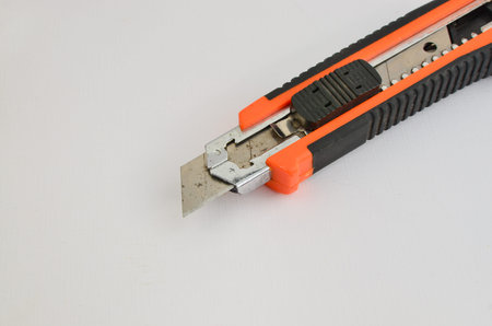 Stylus with a sharp blade on a light background. Precise and versatile cutting tool. Perfect for...