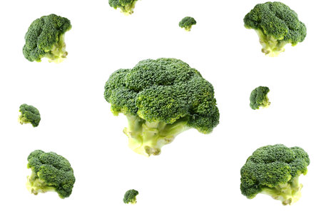 Set of flying pieces of broccoli background