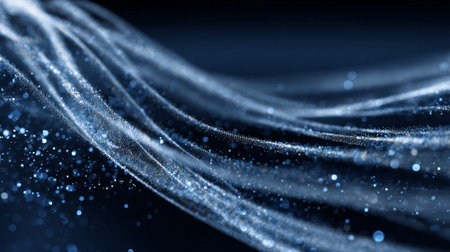 Abstract wave of glowing blue particles on dark background in motion flowの素材