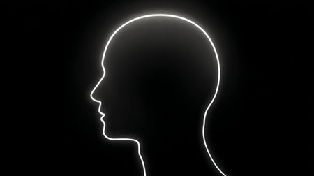 Minimalist glowing human head outline in profile on black backgroundの素材