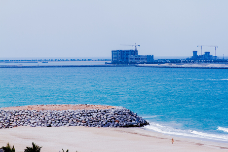 Al Hamra beach with rock wall & coconut trees, a view from Al Hamra Beach Resort March 01, 2017のeditorial素材