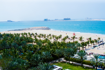 Al Hamra beach with rock wall & coconut trees, a view from Al Hamra Beach Resort March 01, 2017のeditorial素材
