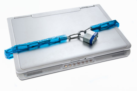 Padlock on laptop computer representing security