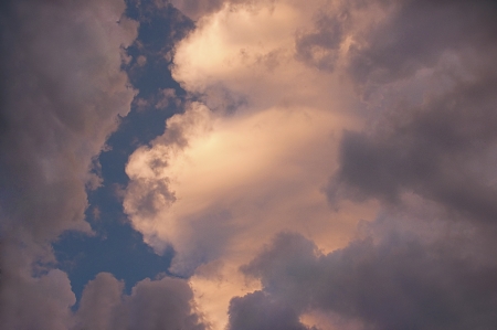 Cloud shaped like wind blow manの写真素材