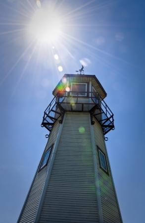 Backlit Sun Lighthouse on Detroit Riverの写真素材