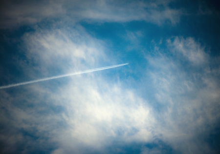 Air Travel in Cloudy Blue Skyの写真素材