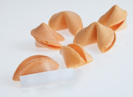 White table top with fortune cookies and messageの写真素材