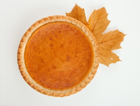 Pumpkin pie with autumn leaves decorの写真素材