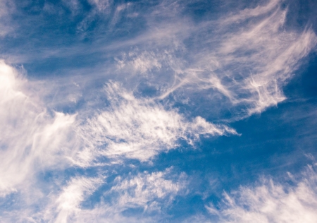 Cloudscape with puffy and whispy cloud patternsの写真素材