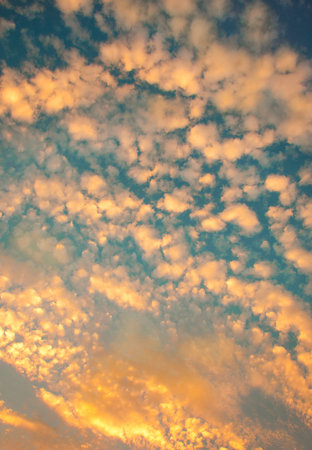 Suns rays beaming from behind clouds