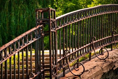Old walk bridge with wrought iron railingの写真素材