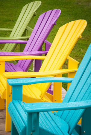 Summer time fancy wood chairs in backyardの写真素材