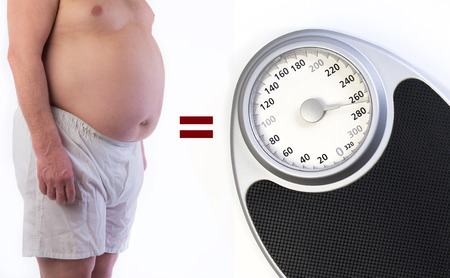 Professional weight scale and Obese maleの写真素材