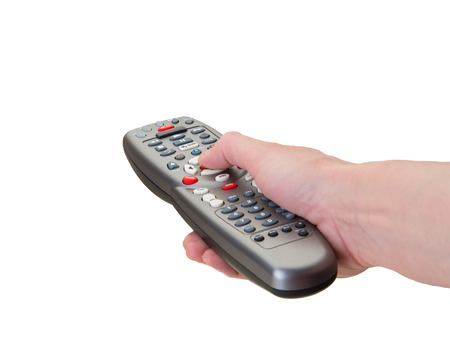 Hand on remote control buttons to blank screenの写真素材