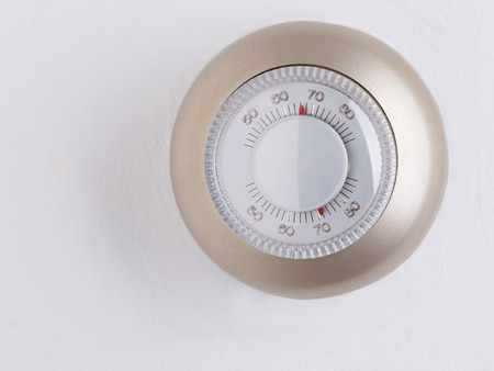 Room wall temperature thermostat turn  dial to setの写真素材