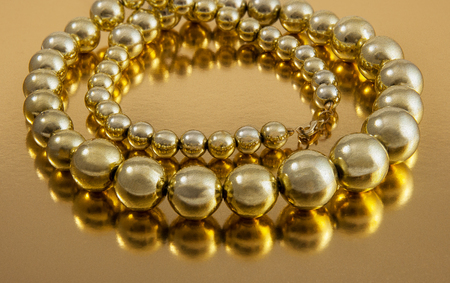 Pearl like beads neck lace on reflective backgrondの写真素材