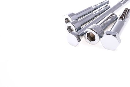 Shiny chrome nuts bolts on white background product photoの写真素材