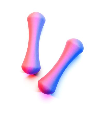 Colorful gel lighting on female hand weights white backgroundの写真素材